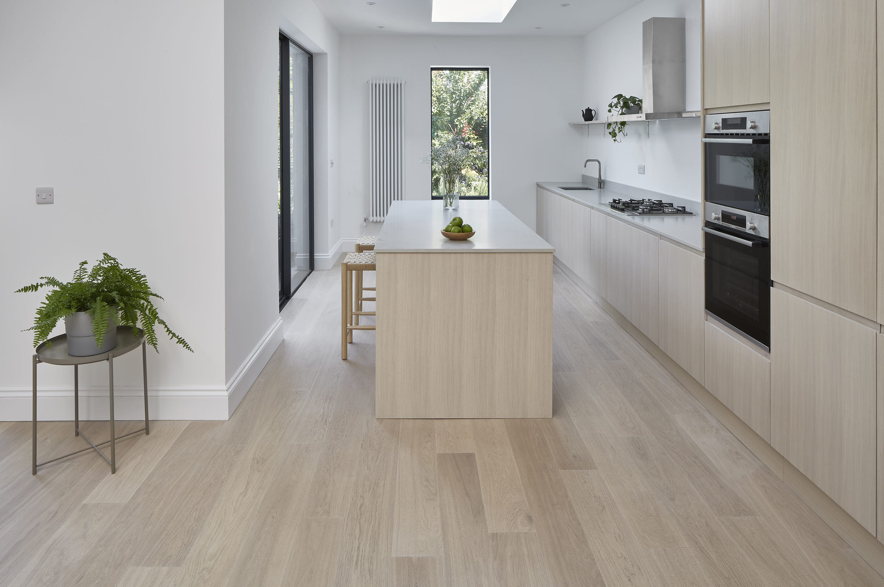 A light wood minimalist modern kitchen