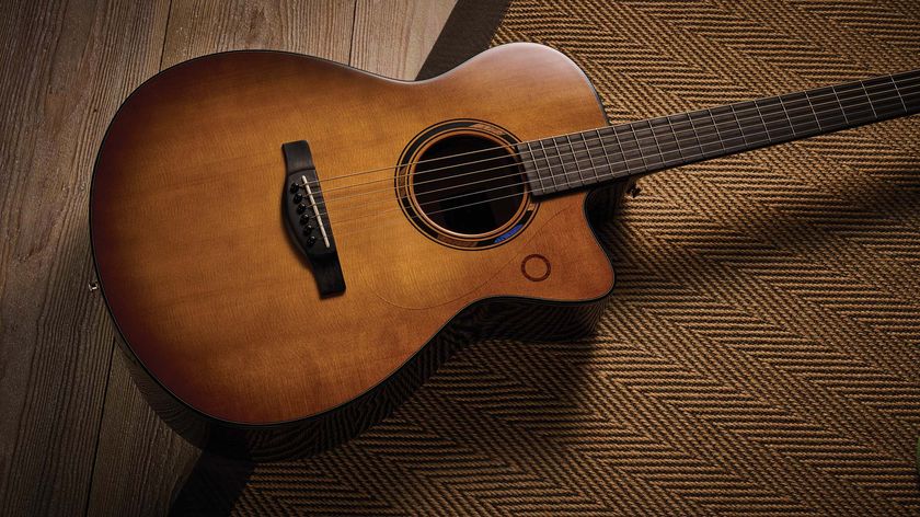 The Yamaha TransAcoustic TAG3 C is a cutaway acoustic guitar with a sandburst finished, photographed in closeup 