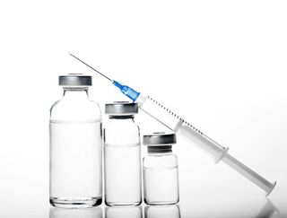 Image of vials of Botox and a syringe.