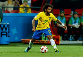Marcelo in action for Brazil against Belgium at the 2018 World Cup.