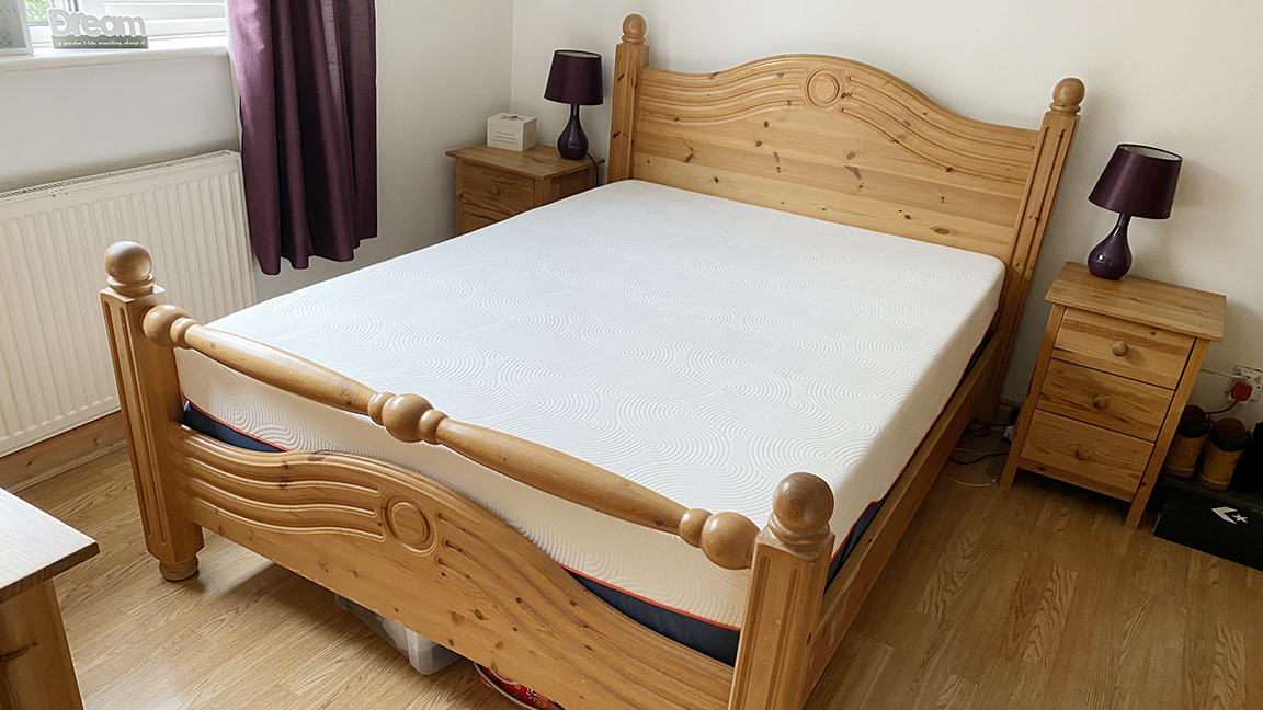 The Brook + Wilde Lux Mattress photographed on a wooden double bed frame at our lead reviewer's home during testing