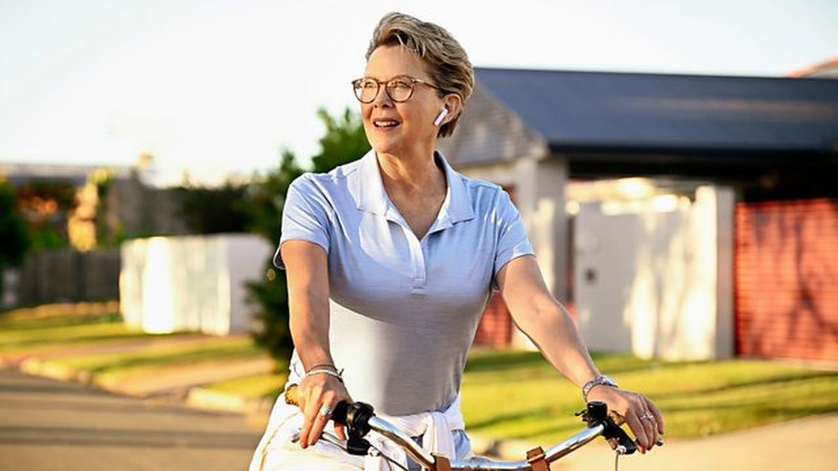 Annette Bening as Joy Delaney riding a bicycle through suburbia in &quot;Apples Never Fall&quot;