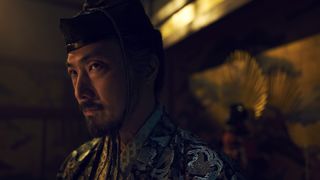 Lord Ishido looks annoyed in a dimly lit shoji in FX's Shogun TV show
