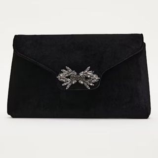 black evening bag with brooch clasp