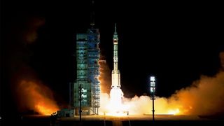 A Chinese Long March 2F rocket launches the three Shenzhou 13 astronauts on a six-month mission to the country's new Tiangong space station module Tianhe from the Jiuquan Satellite Launch Center in the Gobi Desert on Oct.16, 2021.
