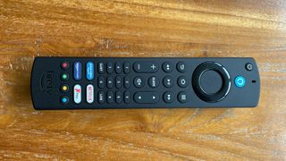 Amazon Fire TV 32-inch 2-Series (HD32N200U) 32-inch TV remote handset on wooden surface