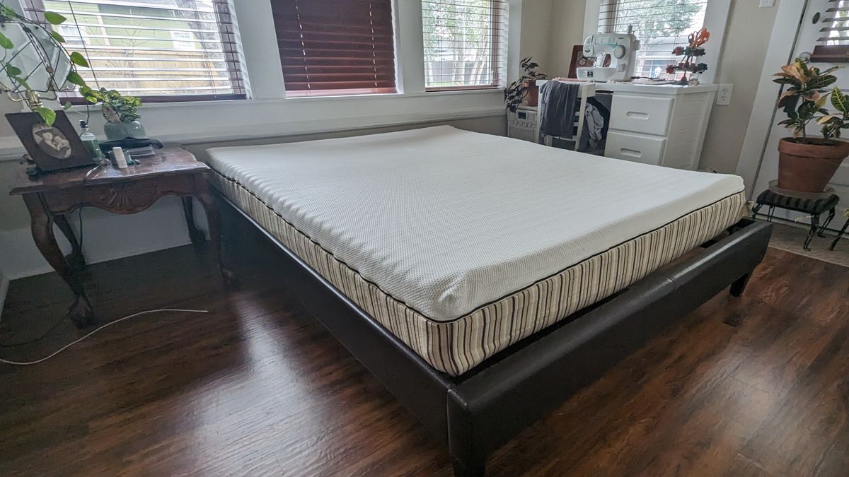 Essentia Stratami organic mattress featured in our lead tester&#039;s bedroom on a brown bed frame