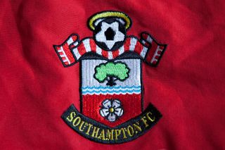 The Southampton badge on a red shirt