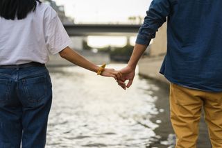 Breakup advice: A woman and man stood holding hands