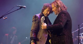 Chris and Rich Robinson go head to head during a Black Crowes show.