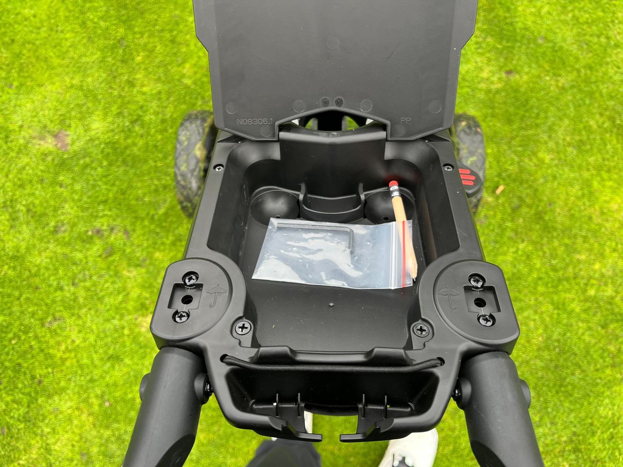The storage area on the BagBoy slimfold push cart