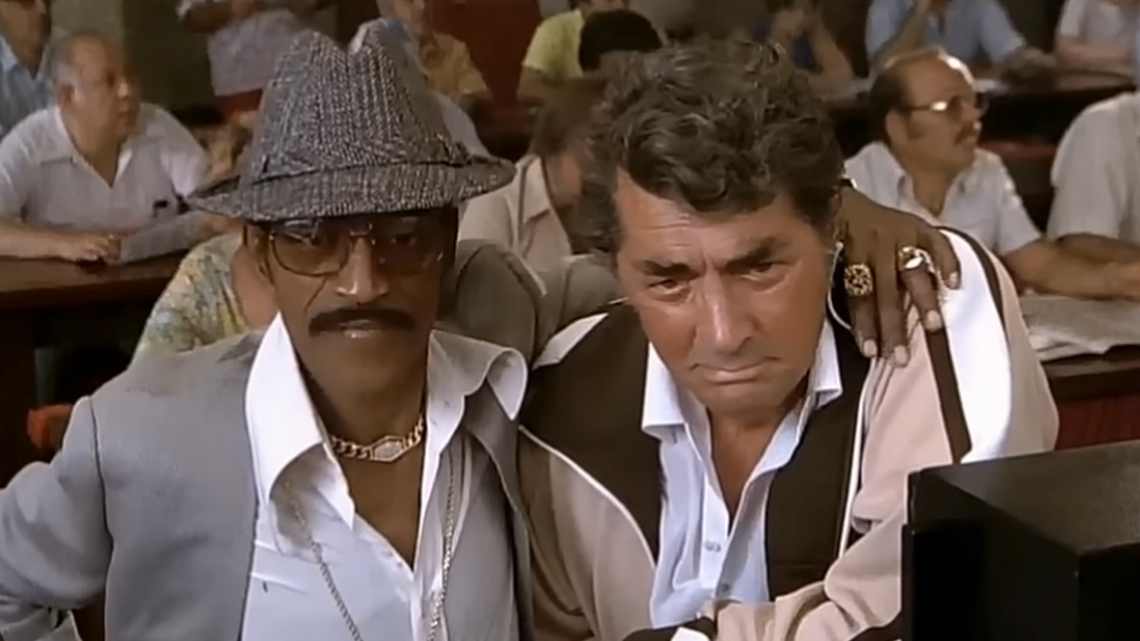 Sammy Davis, J. with his arm around Dean Martin in The Cannonball Run