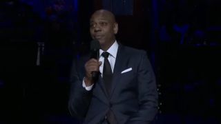 Dave Chappelle performing standup on SNL