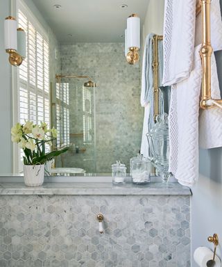 Large mirror in a shower design for a small bathroom.