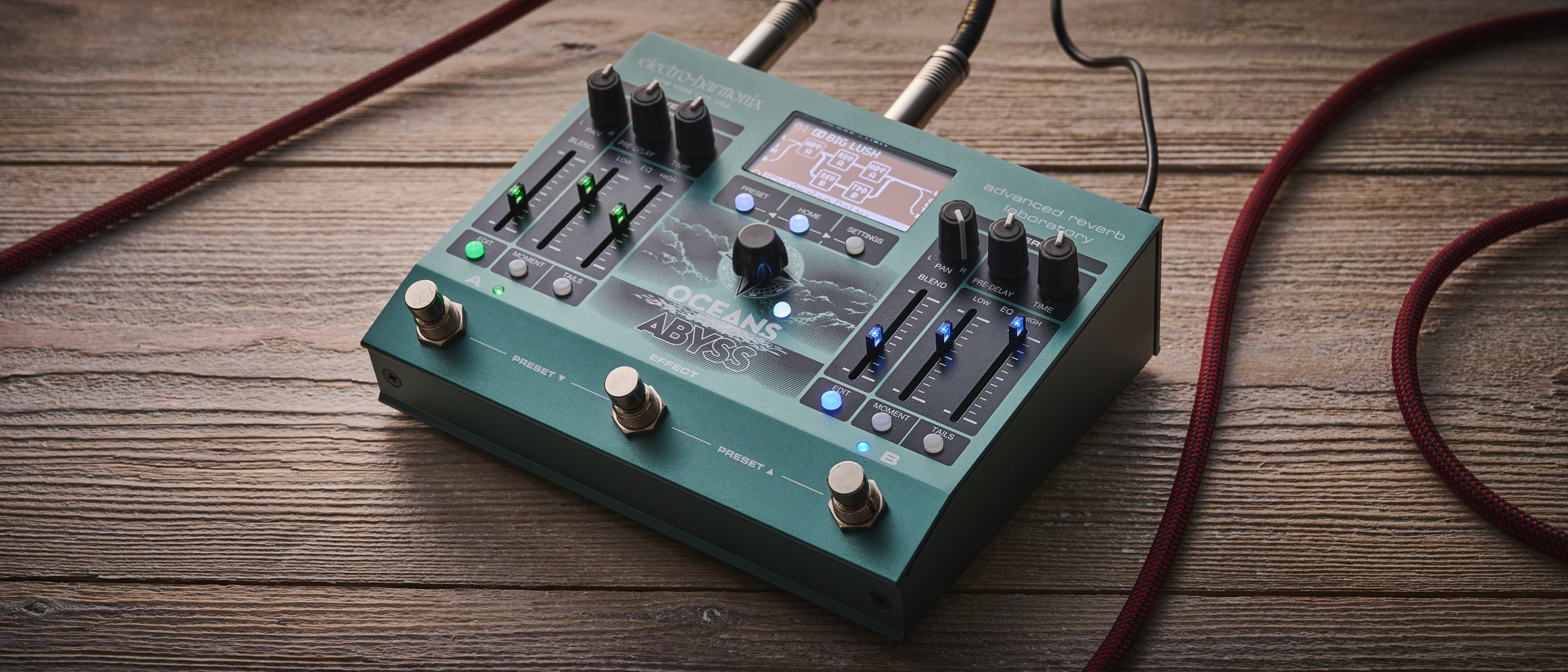 An Electro-Harmonix Oceans Abyss on a wooden floor