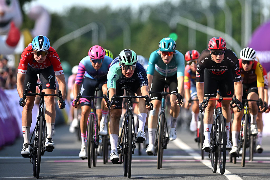 AARSCHOT, BELGIUM - JUNE 20: (L-R) Tim Merlier of Belgium and Team Soudal Quick-Step - Red Points Jersey, stage winner Olav Kooij of Netherlands and Team Decathlon CMA CGM and Petr Kelemen of Czech Republic and Team Tudor Pro Cycling sprint at finish line during the 95th Baloise Belgium Tour 2026, Stage 4 a 183.4km stage from Begijnendijk-Betekom to Aarschot on June 20, 2026 in Aarschot, Belgium. (Photo by Luc Claessen/Getty Images)