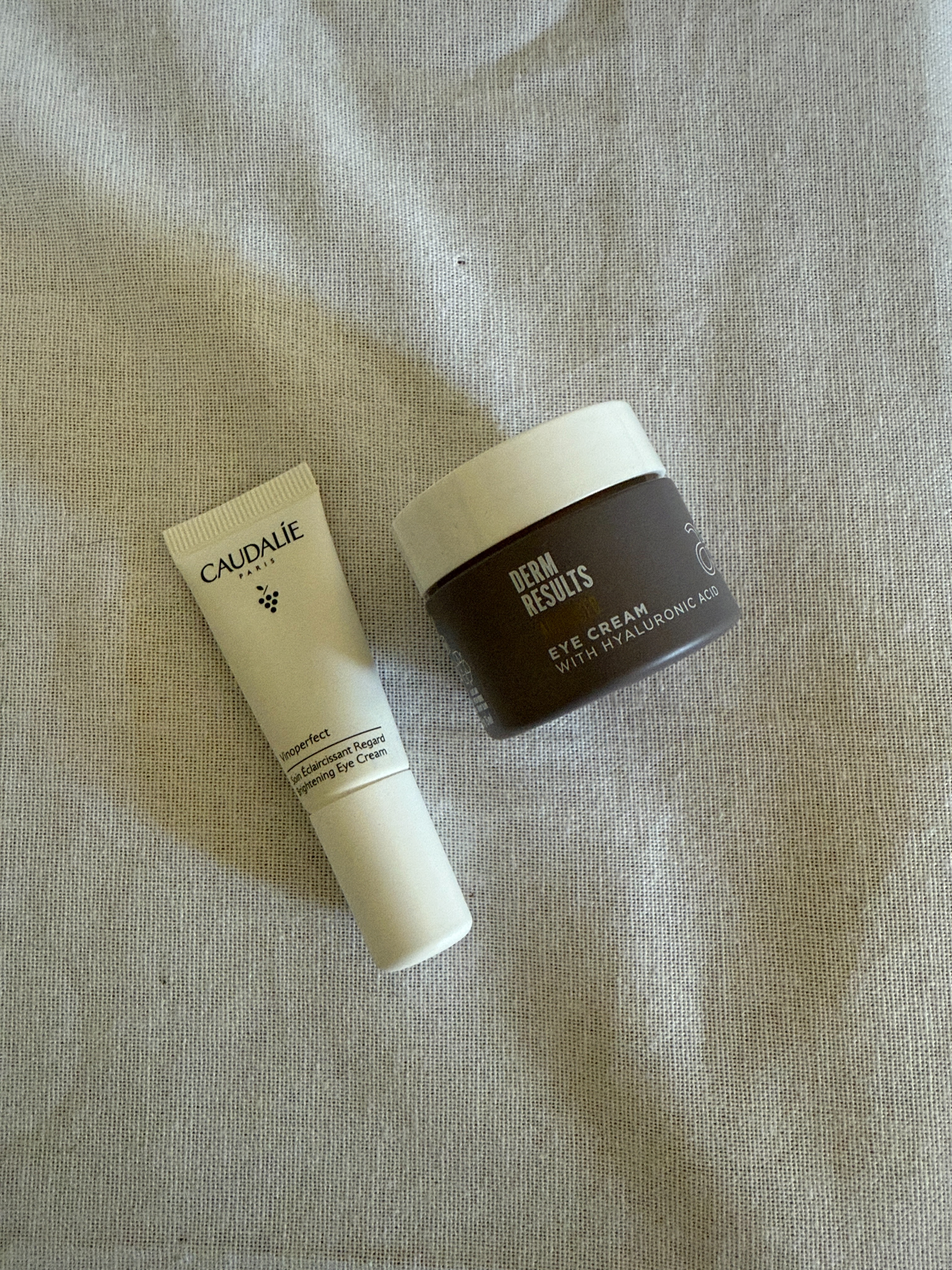 Caudalie's Vinoperfect Dark Circle Brightening Cream and and Arbonne Dermresults Advanced Eye Cream with Hyaluronic Acid