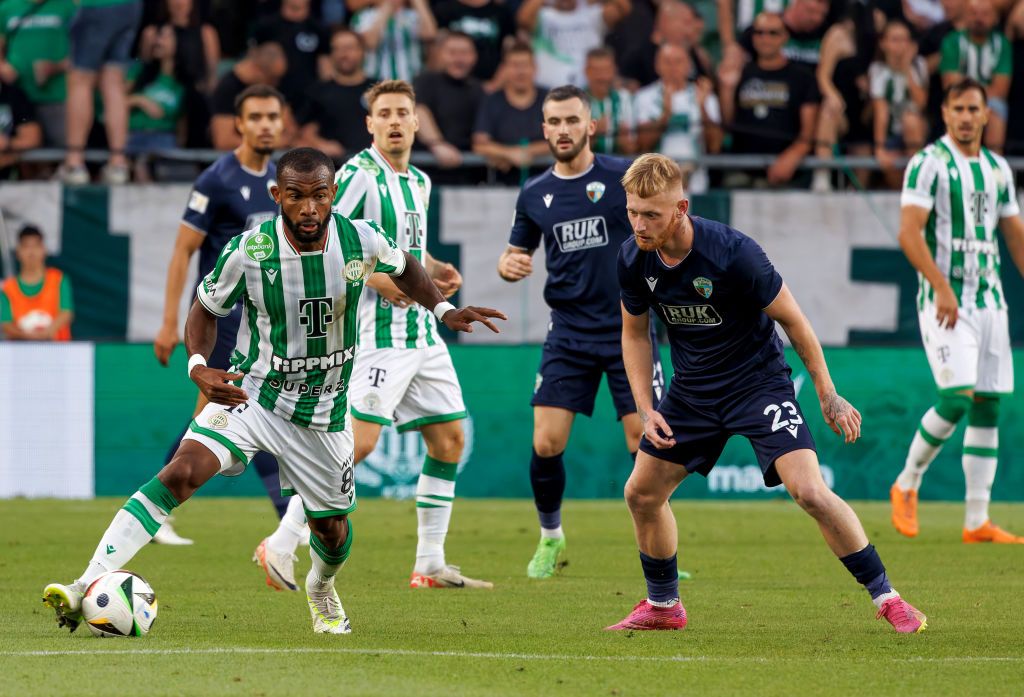 BUDAPEST, HUNGARY - JULY 23: Brad Young of The New Saints FC challenges Habib Maiga of Ferencvarosi TC during the UEFA Champions League Second Qualifying Round 1st leg match between Ferencvaros and The New Saints at Groupama Arena on July 23, 2024 in Budapest, Hungary. (Photo by Laszlo Szirtesi/Getty Images)