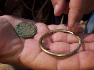 A large gold ring that was likely worn as a bracelet. The richness of the jewelry in the grave reveals the wealth of the people who buried this possible couple.