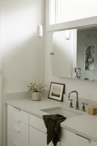 A bathroom with vanity lighting