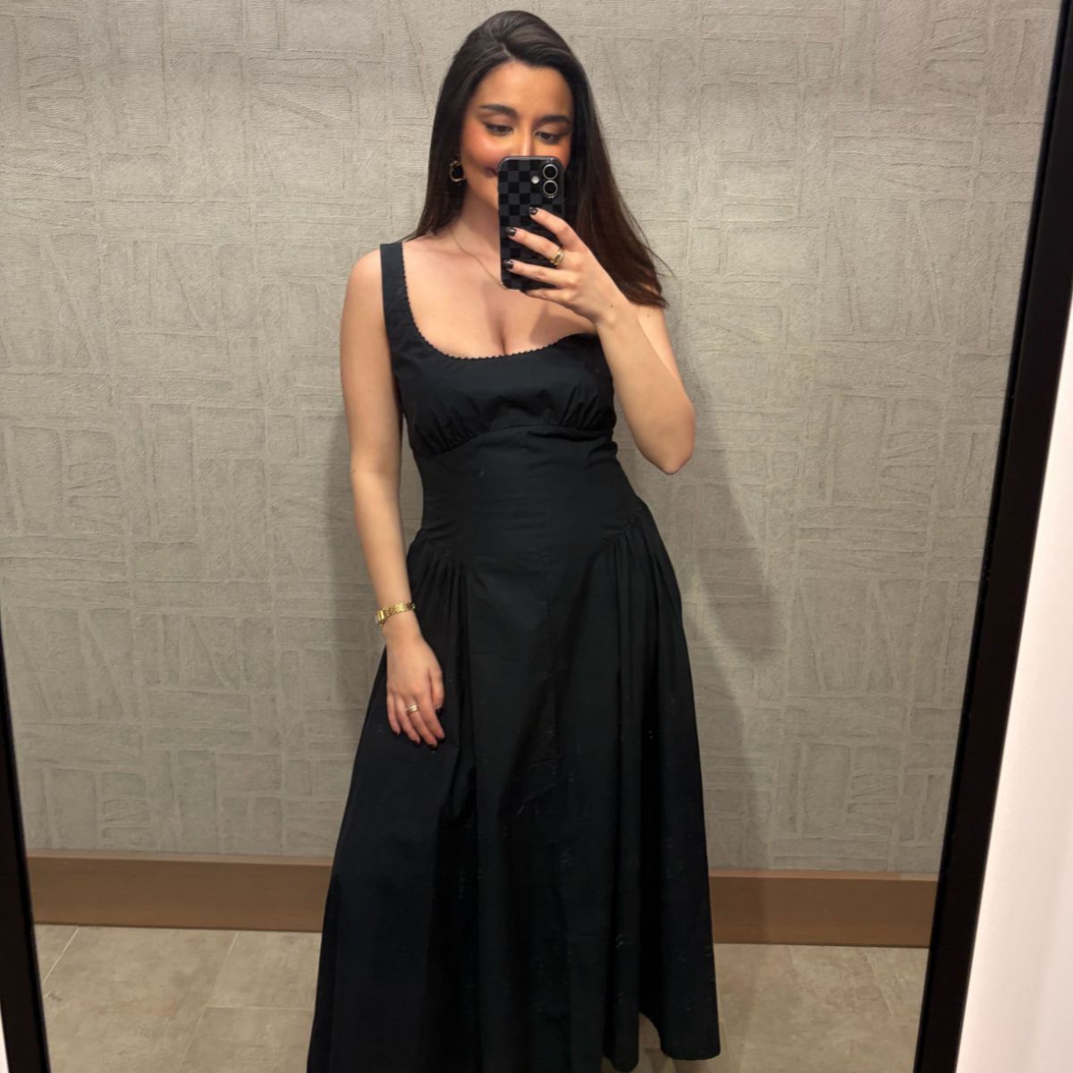 Marina wearing a black Abercrombie dress
