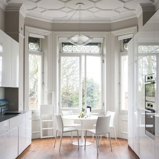 high celing kitchen diner with table and chairs