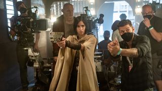 A behind the scenes image of Zack Snyder directing Sofia Boutella in Rebel Moon Part 1: A Child of Fire