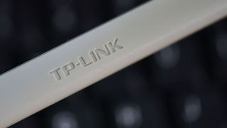 TP-Link router logo on white antenna