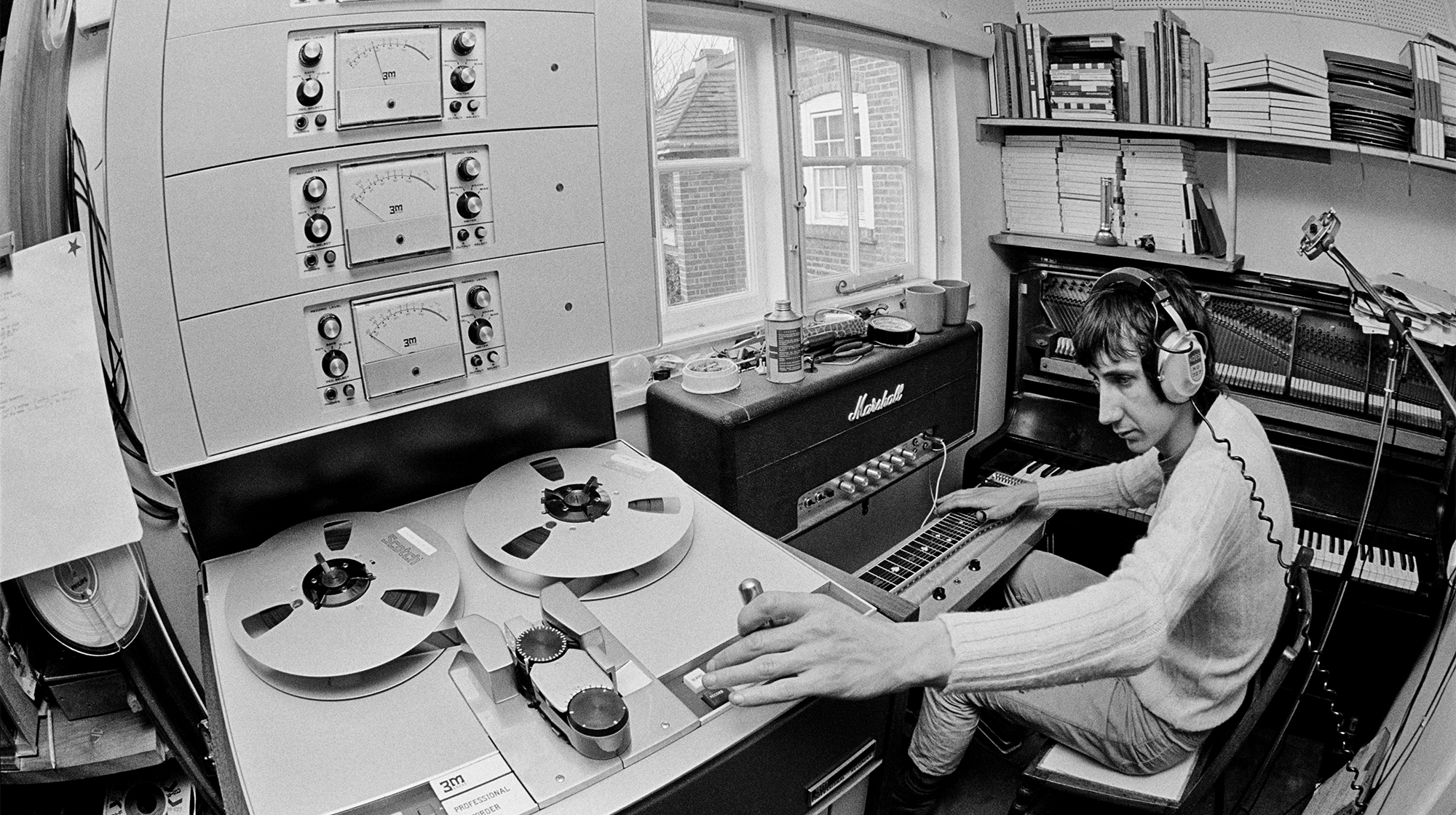 Pete Townshend of The Who, in the recording studio at his home in Twickenham, London, 1969. On the right is a Bechstein upright piano.