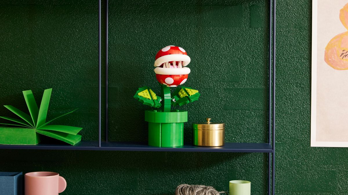 Lego Piranha Plant on a metal shelf against a green wall