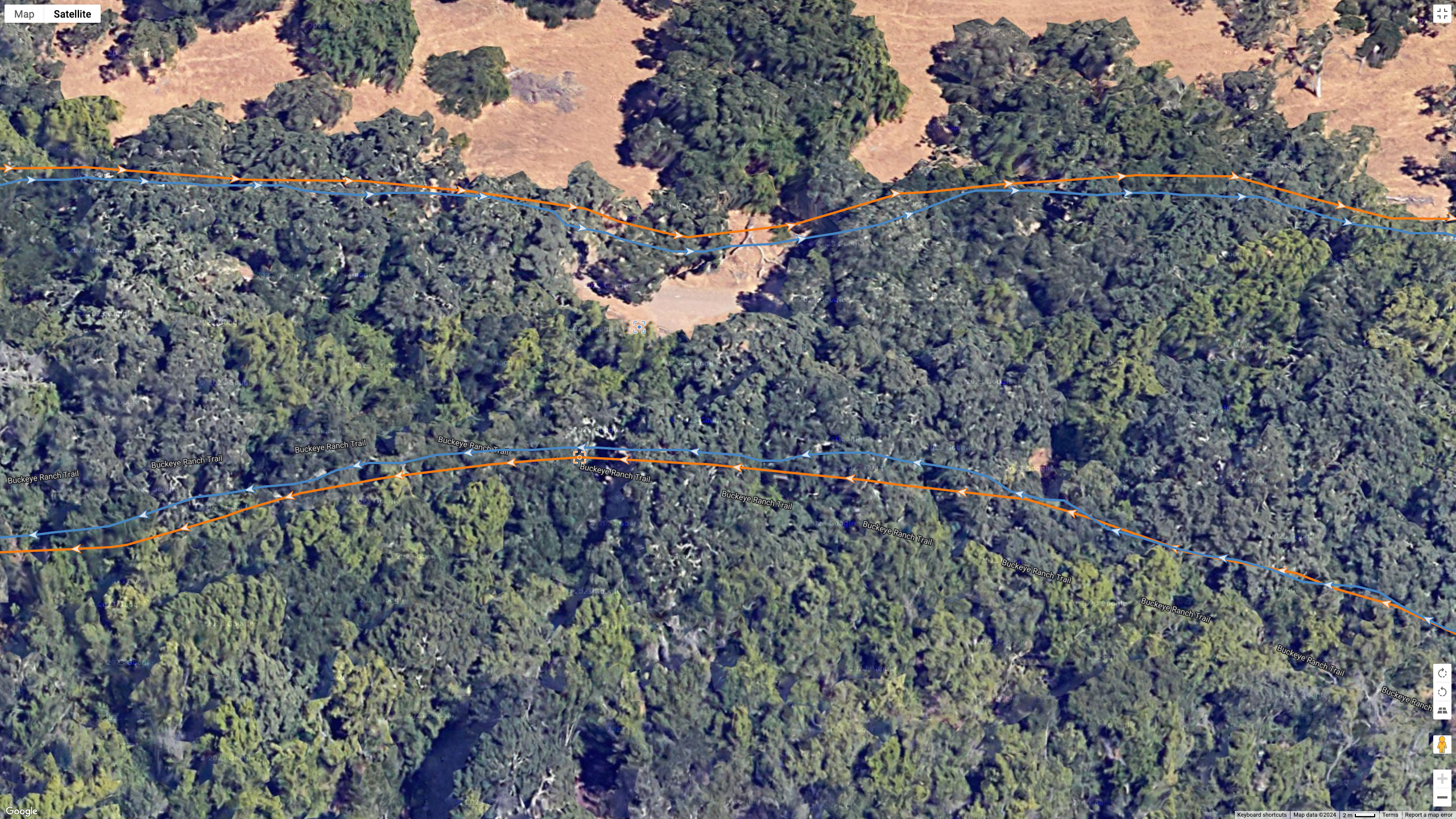 A GPS map showing how the Garmin Forerunner 965 (orange line) and Suunto Race (blue line) compare on a hike with plenty of satellite signal blockage.