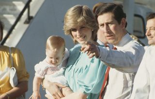 Prince Charles and Princess Diana arrive in Alice Springs, Australia, with their son Prince William