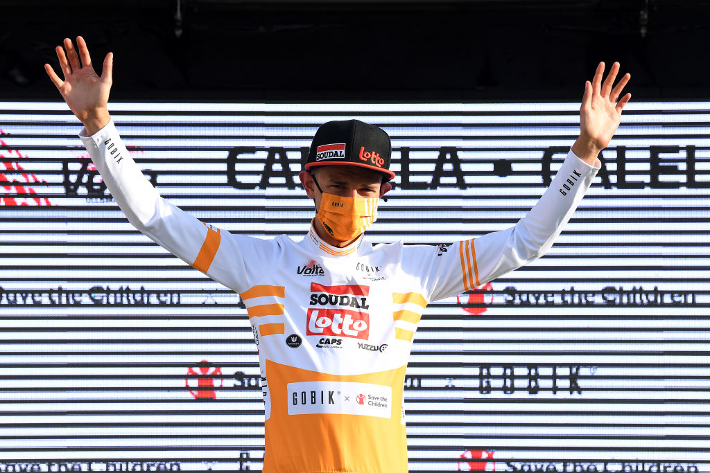 CALELLA SPAIN MARCH 22 Podium Andreas Lorentz Kron of Denmark and Team Lotto Soudal Yellow best young jersey Celebration during the 100th Volta Ciclista a Catalunya 2021 Stage 1 a 1784km stage from Calella to Calella Mask Covid safety measures Trophy VoltaCatalunya100 on March 22 2021 in Calella Spain Photo by David RamosGetty Images