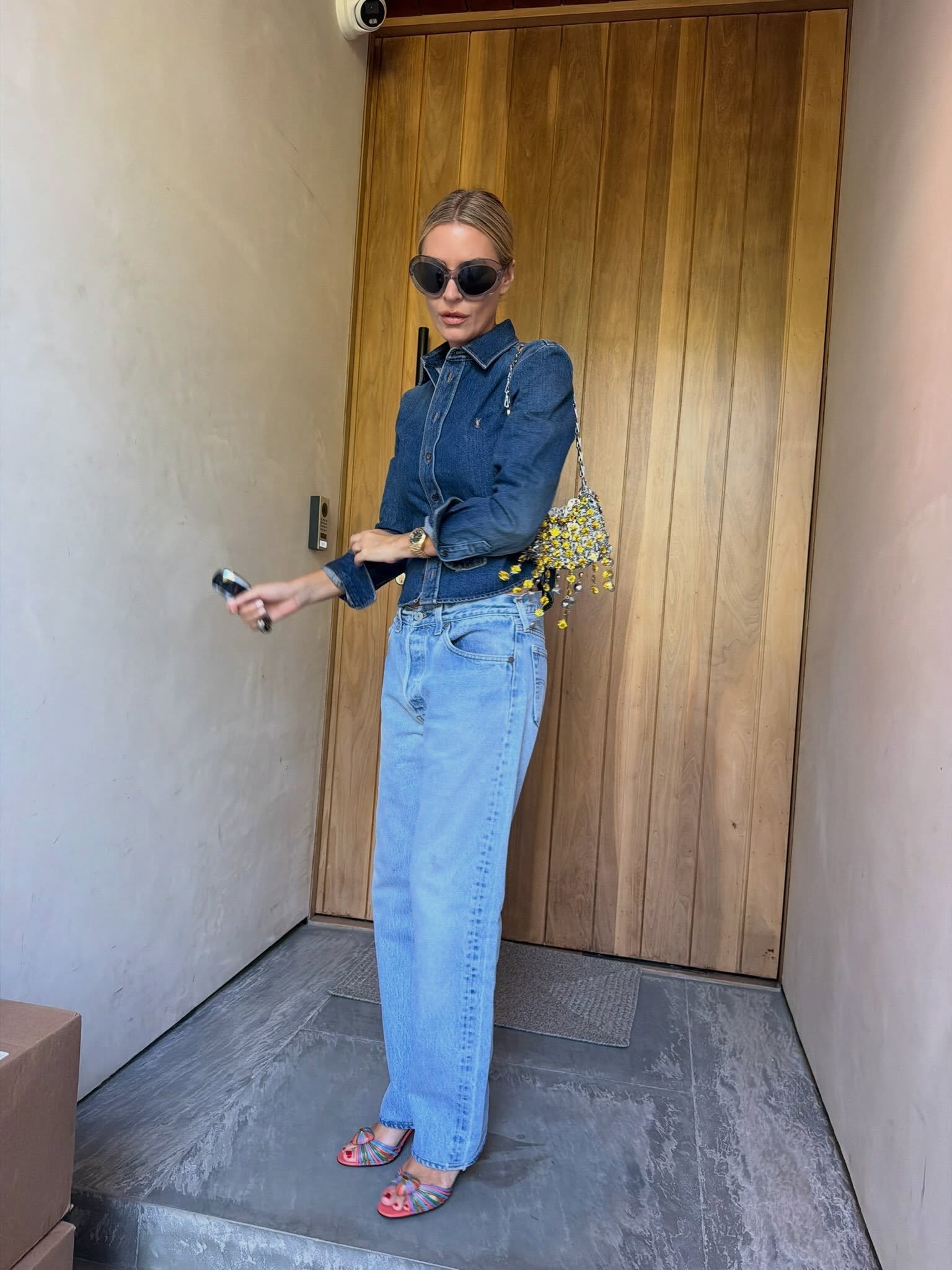 An image of a woman wearing denim shirt outfit 2026