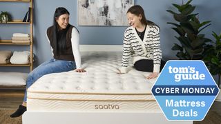 Two mattress testers sit on the Saatva Classic Mattress in a bedroom, a Tom's Guide Cyber Monday mattress deals graphic (right)