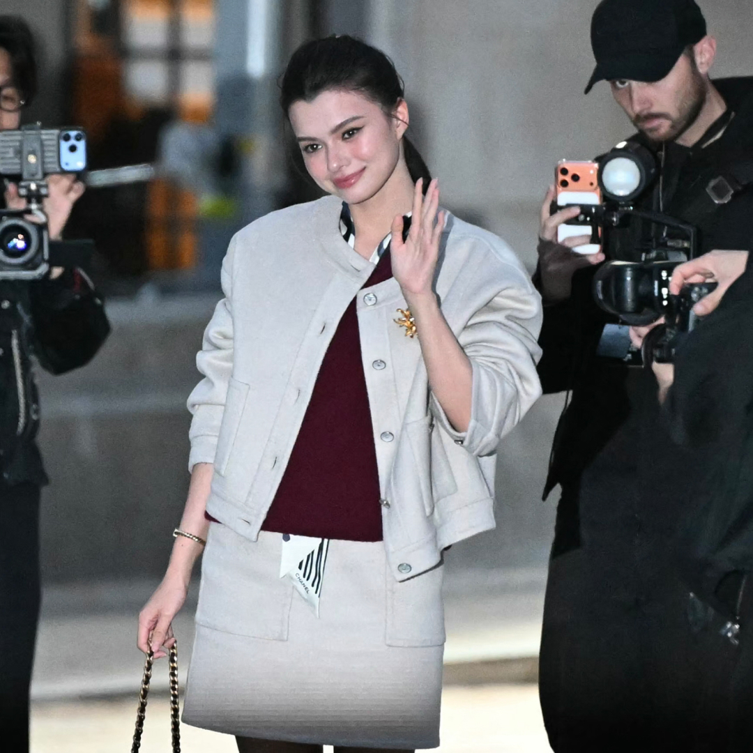 a guest arrives at the chanel show