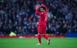 Liverpool foward Mohamed Salah applauds fans