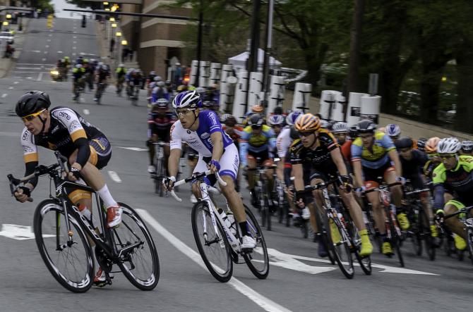 Dan Holloway (Athlete Octane) and Carlos Alzate (UnitedhealthCare) lead the bunch through the fast downhill turn in Winston-Salem during the 4th week of the USA CRITS Series.
