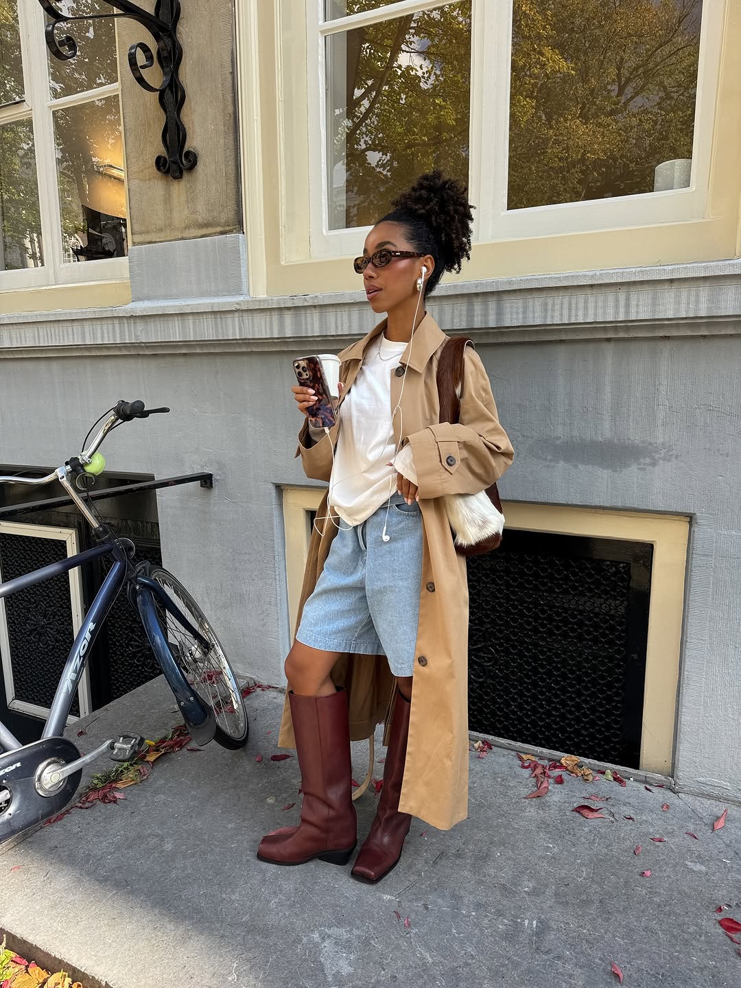 woman wearing bermuda shorts with boots outfit 2025