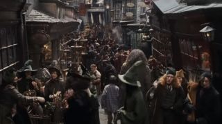 Harry and Hagrid walking through Diagon Alley.