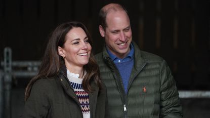 Britain's Prince William, Duke of Cambridge, and Britain's Catherine, Duchess of Cambridge, react during a visit to Manor Farm in Little Stainton, near Durham, north east England on April 27, 2021.