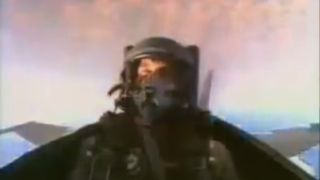 A fighter pilot in a plane, wearing a mask in Pensacola: Wings of Gold