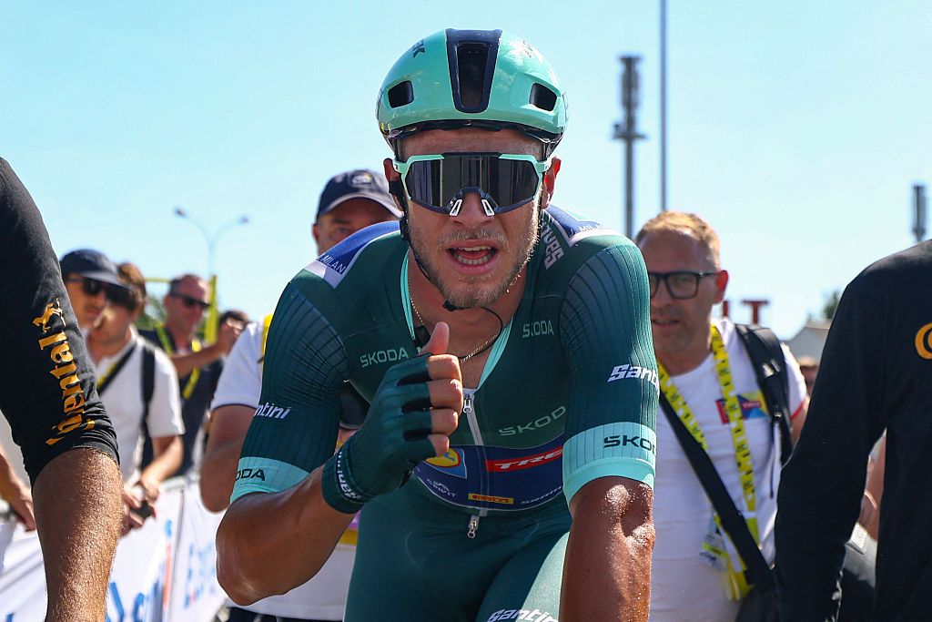 Lidl - Trek team's Italian rider Jonathan Milan wearing the best sprinter's green jersey celebrates after winning the 8th stage of the 112th edition of the Tour de France cycling race, 171.4 km between Saint-Meen-le-Grand and Laval Espace Mayenne, western France, on July 12, 2025. (Photo by SARAH MEYSSONNIER / POOL / AFP) (Photo by SARAH MEYSSONNIER/POOL/AFP via Getty Images)