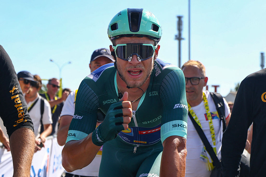 Lidl - Trek team's Italian rider Jonathan Milan wearing the best sprinter's green jersey celebrates after winning the 8th stage of the 112th edition of the Tour de France cycling race, 171.4 km between Saint-Meen-le-Grand and Laval Espace Mayenne, western France, on July 12, 2025. (Photo by SARAH MEYSSONNIER / POOL / AFP) (Photo by SARAH MEYSSONNIER/POOL/AFP via Getty Images)