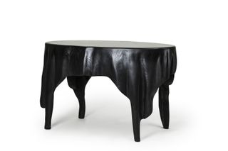 Black wooden table by AHEC