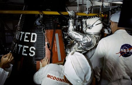 NASA Mercury astronaut Gordon Cooper climbs inside his Faith 7 spacecraft for a launch on May 15, 1963 on the final Mercury program flight.