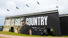 A 'This Is Golf Country' sign with Chris Gotterup on seen on a grandstand at the 2026 Genesis Scottish Open