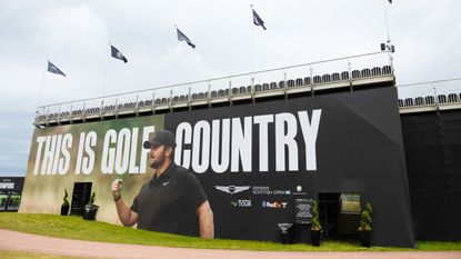 A 'This Is Golf Country' sign with Chris Gotterup on seen on a grandstand at the 2026 Genesis Scottish Open