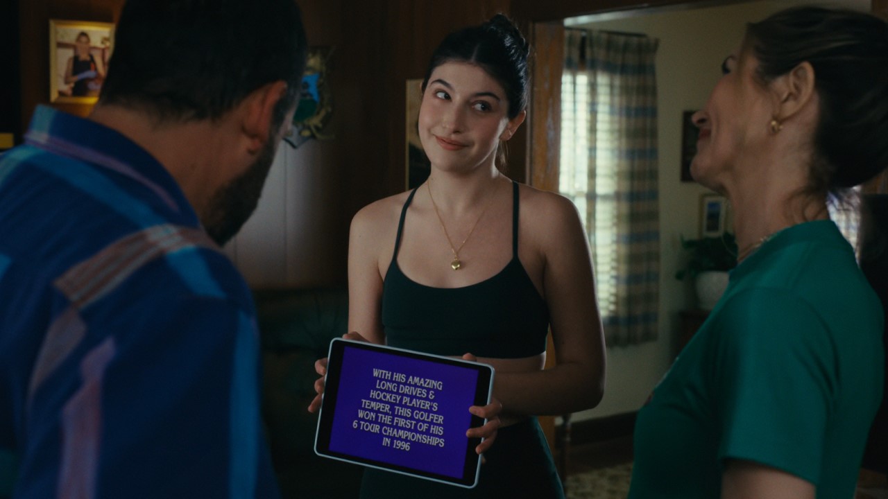 Vienna Gilmore (Sunny Sandler) shows her dad that he's a clue on Jeopardy! in Happy Gilmore 2.