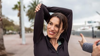 a 40 year old woman stretching